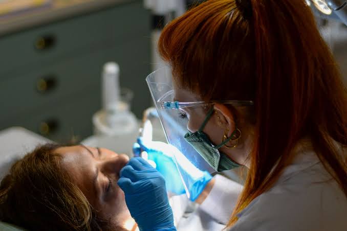 Dental treatment room with clinician and patient